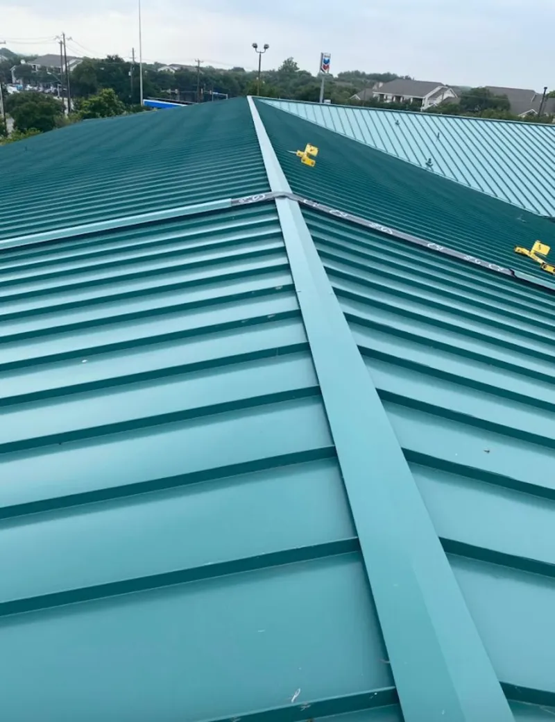Green commercial metal roof ridge and valley for Metal Roof Repair in Wildwood